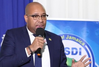 Minister of State in the Ministry of Industry, Investment and Commerce, Hon. Delano Seiveright, outlines upcoming employment opportunities in the hospitality sector while addressing graduates at the Central Jamaica Social Development Initiative (CJSDI) training programme graduation ceremony, held at the Golf View Hotel in Manchester, on Sunday, December 14.

