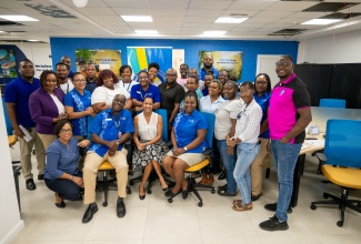 Tourism Product Development Company (TPDCo) Training Manager for the Western Region, Megan Mollison (left, front row), is pictured with Clinical Director at Dr. K.A.D. Morgan & Associates, Verol Billett (fifth left, second row); Managing Director of Amstar Destination Management Company, Arla Vernon (front row, centre); and Administration Officer in TPDCo’s Training Department, Romario Bennett (right), alongside Amstar DMC team members. The photograph was taken following the culmination of TPDCo’s Post‑Hurricane Melissa Pilot Mental Health Intervention Programme for tourism workers at Amstar’s Montego Bay office.


