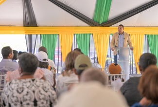 Prime Minister, Dr. the Most Hon. Andrew Holness, addresses a land titling ceremony held at the Lacovia Community Centre in St. Elizabeth on Friday (December 12). 