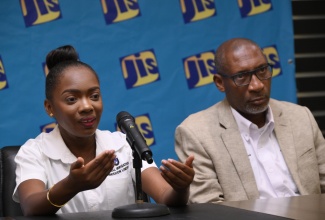 Public Education Specialist with the National Irrigation Commission (NIC), Christeen Forbes, speaks at a recent JIS Think Tank at the agency’s Television Department, 5-9 South Odeon Avenue in Kingston. Listening is Director of Engineering and Technical Services at the NIC, Rohan Stewart.