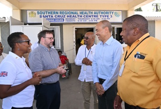 United Kingdom (UK) Minister for the Caribbean, Chris Elmore (second left), shares in discussion with (from left) UK High Commissioner to Jamaica, Her Excellency, Alicia Herbert; Parish Manager for St. Elizabeth Health Services, Sean Brissett; Chairman of the Southern Regional Health Authority (SRHA), Wayne Chen; and Regional Director at the SRHA, Michael Bent. Occasion was a tour of the Santa Cruz Health Centre in St. Elizabeth on Tuesday (December 2) by Mr. Elmore, during his recent visit to the island.