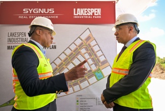 Prime Minister, Dr. the Most Hon. Andrew Holness (right), in discussion with Vice President and Head of Real Estate and Project Finance, Sygnus Capital, David Cummings, during the official ground-breaking ceremony for the US$20-million Lakes Pen Industrial Park in St. Catherine on Tuesday (December 9).