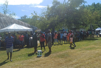 Westmoreland residents line up to register for grant assistance during the Ministry of Labour and Social Security