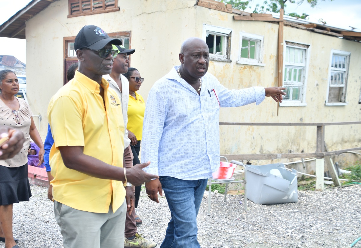 Minister of Local Government and Community Development, Hon. Desmond McKenzie (left) and Mayor of Savanna-la-Mar, Councillor Danree Delancy, tour a section of the Westmoreland Infirmary on December 3. 

