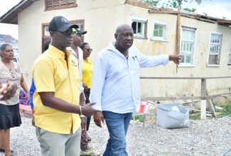 Minister of Local Government and Community Development, Hon. Desmond McKenzie (left) and Mayor of Savanna-la-Mar, Councillor Danree Delancy, tour a section of the Westmoreland Infirmary on December 3. 

