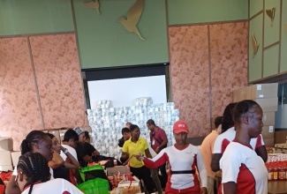 RIU Montego Bay staff members assist in putting together hurricane relief care packages for fellow coworkers.

