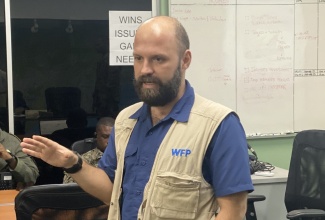 Cash Officer,  World Food Programme (WFP), Lorenzo Nerantzis, addresses a recent meeting of the National Emergency Operations Centre (NEOC), at the Office of Disaster Preparedness and Emergency Management (ODPEM) in Kingston.

