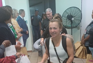 Visitors arrive at Sangster International Airport in Montego Bay on the eve of the December 15 start of the 2025/26 winter tourist season.

