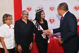 Minister of Health and Wellness, Dr. the Hon. Christopher Tufton (right), greets newly crowned Miss Global Jamaica 2026, Deidrian Downer, during Tuesday’s (January 27) Heart Month Media Launch at the Terra Nova All-Suite Hotel in St. Andrew. Others (from left) are Executive Director, Heart Foundation of Jamaica (HFJ), Deborah Chen; and guest speaker at the event, Dr. Michael Abrahams.

