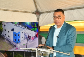 Prime Minister, Dr. the Most Hon. Andrew Holness, delivers the keynote address at the handover ceremony for a multi-family housing unit on Friday (Jan. 30) at 1 Brooks Level Road in Stony Hill, St. Andrew, which was constructed under the New Social Housing Programme (NSHP).