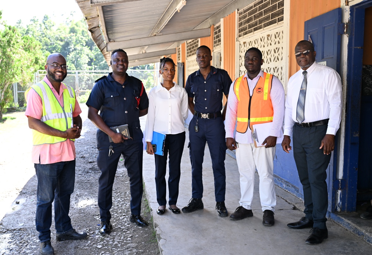 Parish Disaster Coordinator for St Mary, Adrian Tate (second right), with (from left) Dean of Discipline at the St Mary Technical High School, Ryan Hewitt; Officer in charge of the Fire Safety, Prevention and Investigation Division, District Officer Richard Guscott; Assistant at the Jamaica Fire Brigade, Shaneldeen Bailey; Acting Corporal in the Fire Safety, Prevention and Investigation Division, Kyron Parry; and Vice Principal, Orville Jones, after completing earthquake drills at the St. Mary Technical High School, recently.

