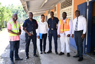 Parish Disaster Coordinator for St Mary, Adrian Tate (second right), with (from left) Dean of Discipline at the St Mary Technical High School, Ryan Hewitt; Officer in charge of the Fire Safety, Prevention and Investigation Division, District Officer Richard Guscott; Assistant at the Jamaica Fire Brigade, Shaneldeen Bailey; Acting Corporal in the Fire Safety, Prevention and Investigation Division, Kyron Parry; and Vice Principal, Orville Jones, after completing earthquake drills at the St. Mary Technical High School, recently.

