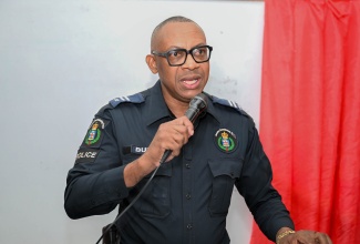 Inspector Donald Burke of the Jamaica Constabulary Force (JCF), Bath Division, speaks at a community forum at the Bath Primary School in St. Thomas, on January 28.
