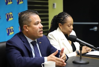 Minister of Water, Environment and Climate Change,  Hon. Matthew Samuda (left) and Manager of the Ecosystems Management Branch at the National Environment and Planning Agency (NEPA), Monique Curtis, participate in a recent JIS Think Tank. 


