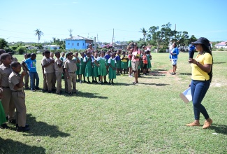 Acting Parish Disaster Coordinator at the St. Elizabeth Municipal Corporation, Rasha Lloyd, engages students and staff of Sandy Bank Primary School at the assembly point following an earthquake drill on Tuesday (January 20) in St. Elizabeth, as part of Earthquake Awareness Month.

