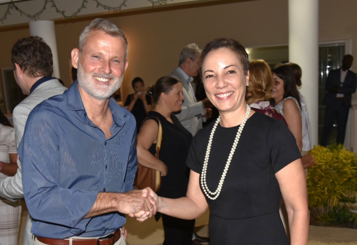 Minister of Foreign Affairs and Foreign Trade, Senator the Hon. Kamina Johnson Smith (right) is greeted by Ambassador of the Federal Republic of Germany to Jamaica, His Excellency Jan Hendrik van Thiel, upon her arrival at a New Year’s Reception held at the German Embassy in Kingston on Tuesday evening (January 20).

 