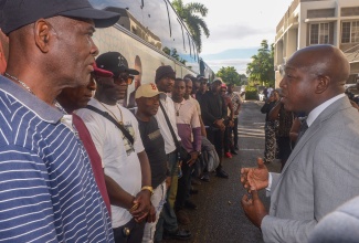 Minister of Labour and Social Security, Hon. Pearnel Charles Jr., addresses farm workers ahead of their departure for Canada, under the Canadian Seasonal Agricultural Workers Programme (SAWP) on Wednesday (January 6). The send-off event was held at the Ministry's Overseas Employment Centre located on East Street, downtown Kingston.

