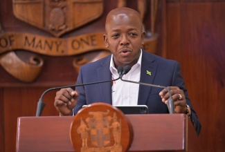 Minister of Labour and Social Security, Hon. Pearnel Charles Jr., addresses a post-Cabinet press briefing held at Jamaica House in Kingston on Wednesday (January 14).


