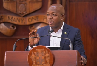 Minister of Labour and Social Security, Hon. Pearnel Charles Jr., addresses a post-Cabinet press briefing at the Office of the Prime Minister in Kingston, on Wednesday (January 14).

