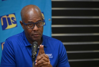 Past President of the Incorporated Masterbuilders Association of Jamaica (IMAJ), Lenworth Kelly, addresses a recent JIS Think Tank.

