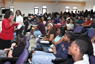 Minister of State in the Ministry of Justice and Constitutional Affairs, Hon. Marisa Dalrymple-Philibert, addresses first-year law students pursuing Constitutional Law at the Faculty of Law, University of the West Indies, Mona, on January 19. The Ministry handed over 300 hard copies of the Consolidated Constitution of Jamaica to the students.

