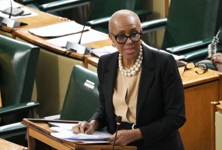 Minister of Finance and the Public Service, Hon. Fayval Williams, addresses the House of Representatives on Tuesday (January 20).

