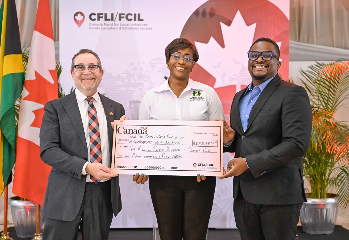 Patron of the Save our Boys and Girls Foundation and Member of Parliament for St. Andrew East Rural, the Most Hon. Juliet Holness (centre), and EduFocal co-founder and Chief Executive Officer (CEO), Gordon Swaby (right), receive a cheque from High Commissioner of Canada to Jamaica, His Excellency Mark Berman, during the Canada Fund for Local Initiatives (CFLI) Spotlight Event, held at the Terra Nova All-Suite Hotel in Kingston, on Thursday (January 22).

