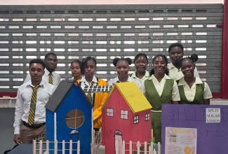 Students of Green Pond High School in St. James, display their Split Solar Vision project as a renewable energy solution during the STEAM (Science, Technology, Engineering, Arts and Mathematics) In Action Expo, held on Thursday (January 29) at the Chinese Benevolent Association in St. Andrew.


