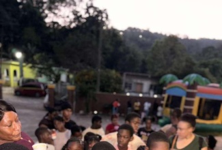 Children and adults at a recent family fun day organised by charity We Blossom Foundation Inc, at Mary Village in Sligoville, St. Catherine.