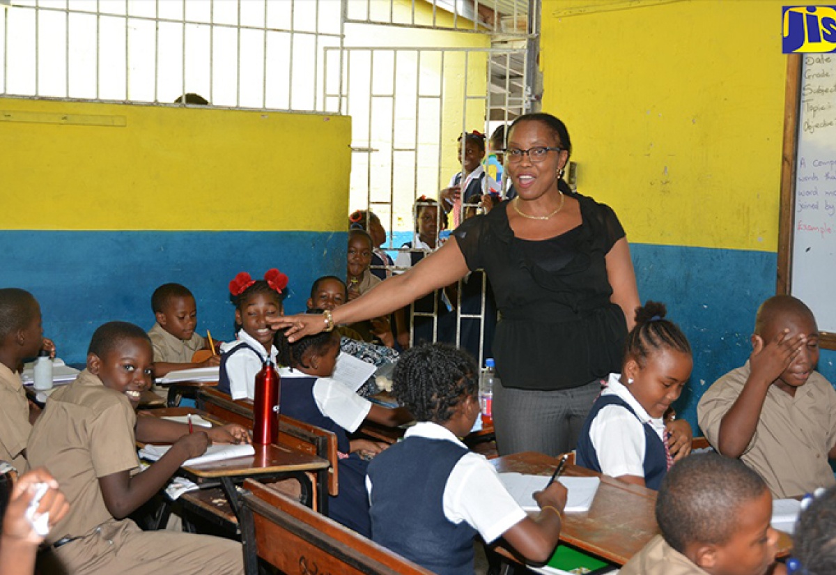 Principal of Petersfield Primary and Infant School, Susan Rattray Hammond, speaks to students in a classroom.

