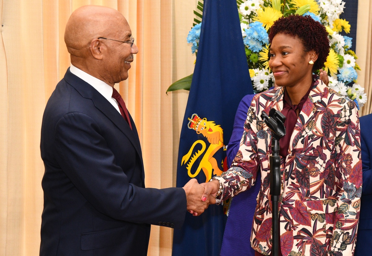 Governor-General, His Excellency the Most Hon. Sir Patrick Allen (left), greets the 2026 Rhodes Scholar, Tiana Dinham, at a recent ceremony, held at King’s House in St. Andrew, to announce the scholarship.

