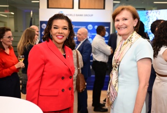 Minister without Portfolio in the Office of the Prime Minister with responsibility for Efficiency, Innovation and Digital Transformation, the Hon. Ambassador Audrey Marks (left), shares a photo with World Bank Director for Caribbean Countries, Lilia Burunciuc, during the official opening of the World Bank