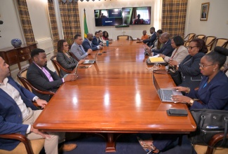 Prime Minister, Dr. the Most Hon. Andrew Holness (fourth left), in a meeting with officials from the Ministry of Labour and Social Security, Office of the Cabinet, and the Office of Disaster Preparedness and Emergency Management (ODPEM), on January 8, at the Office of the Prime Minister. 

