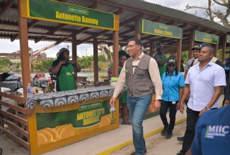  Prime Minister, Dr. the Most Hon. Andrew Holness  (left) tours the grounds of the popular Border roadside eatery in St. Elizabeth, following the official ceremony to reopen the 44 shops at the facility on January 16. He is accompanied by Minister of Agriculture, Fisheries and Mining, Hon. Floyd Green.
