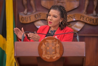 Minister without Portfolio in the Office of the Prime Minister with Responsibility for Efficiency, Innovation and Digital Transformation, Ambassador, the Hon. Audrey Marks, addresses the ceremony for the official launch of the implementation of the flexible work arrangement in the public sector at Jamaica House, St. Andrew, on January 29.

