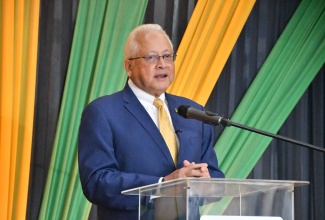 Minister of Justice and Constitutional Affairs, Hon. Delroy Chuck, delivers the keynote address during Friday’s (January 30) Commissioning Ceremony for Justices of the Peace (JPs) in St. James at the Grand-A-View Event Place.