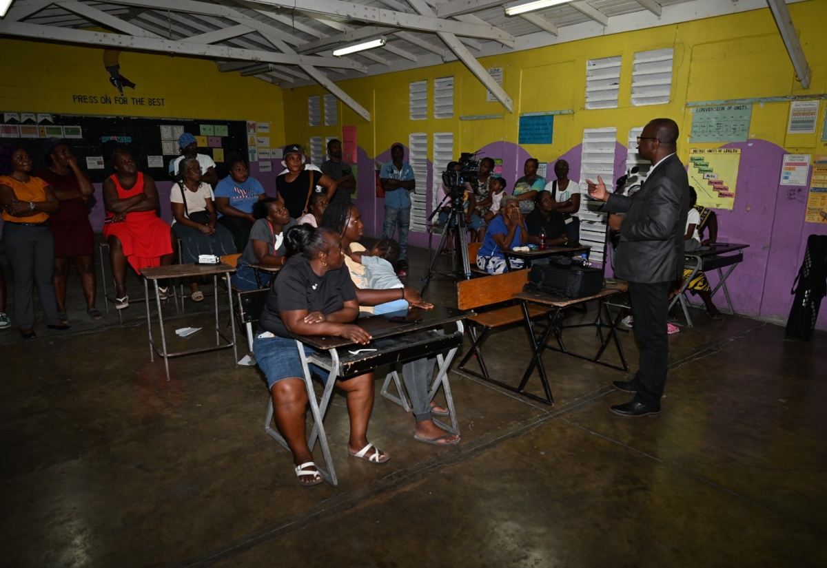 Chief Executive Officer (CEO) of the St. Thomas Municipal Corporation, Kevin McIndoe, engages with residents at a town hall held at the Easington Primary School on January 15, to discuss disposal of the 100-acre Easington property owned by the Municipal Corporation.