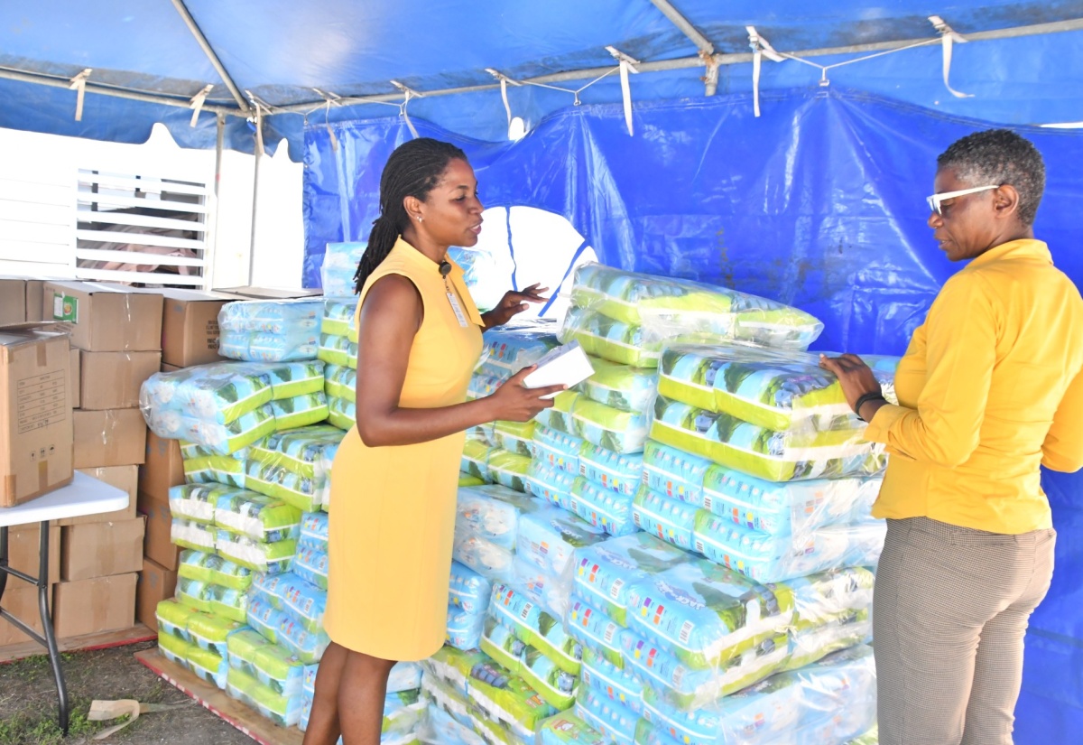 Chief Executive Officer at the Black River Hospital in St. Elizabeth, Diana Brown Miller  (right) and Paediatrician at the facility, Dr. Allison Isaacs,  look at infant and maternity supplies donated to the hospital by the Digicel Foundation. The items, valued at $1.3 million,  were handed over at the hospital on Thursday ( Jan. 15).