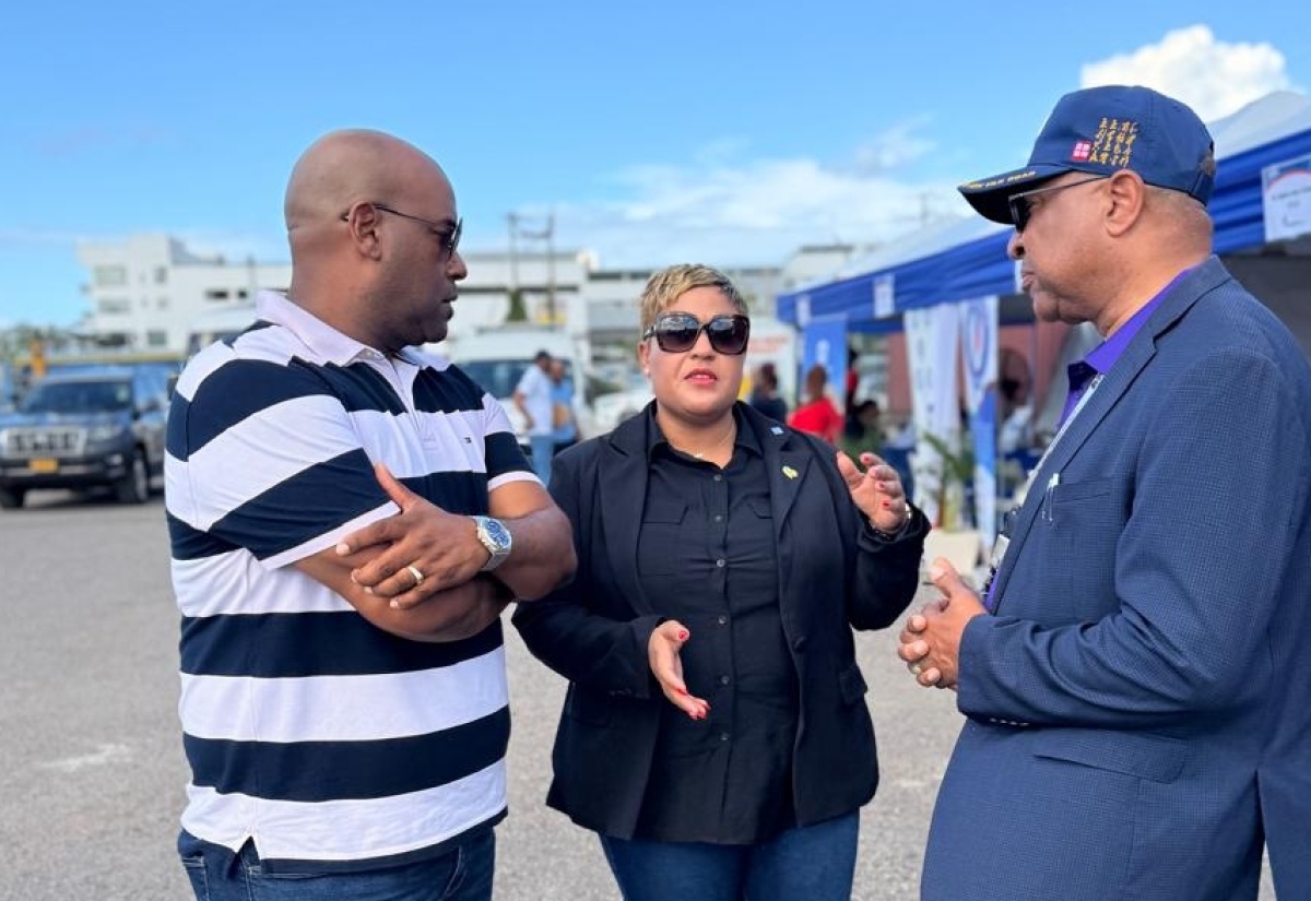 Minister of State in the Ministry of Health and Wellness, Hon. Krystal Lee, converses with Deputy Mayor of Montego Bay, Councillor Dwight Crawford (left), and Western Regional Health Authority (WRHA) Regional Director, St. Andrade Sinclair, during the WRHA Healthcare Workers’ Support Fair at Pier 1 in Montego Bay, St. James, on Friday (January 9).


