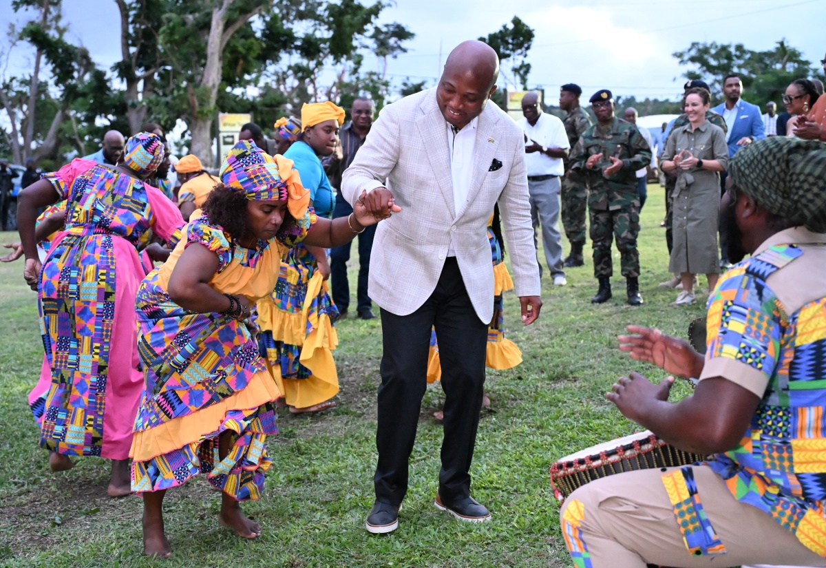 Minister of Foreign Affairs of the Republic of Ghana, His Excellency Samuel Okudzeto Ablakwa (centre), dances with the Charles Town Maroon group during a welcome reception and tour at the Seville Great House in St. Ann, on Sunday (January 25). Observing in the background is Jamaica