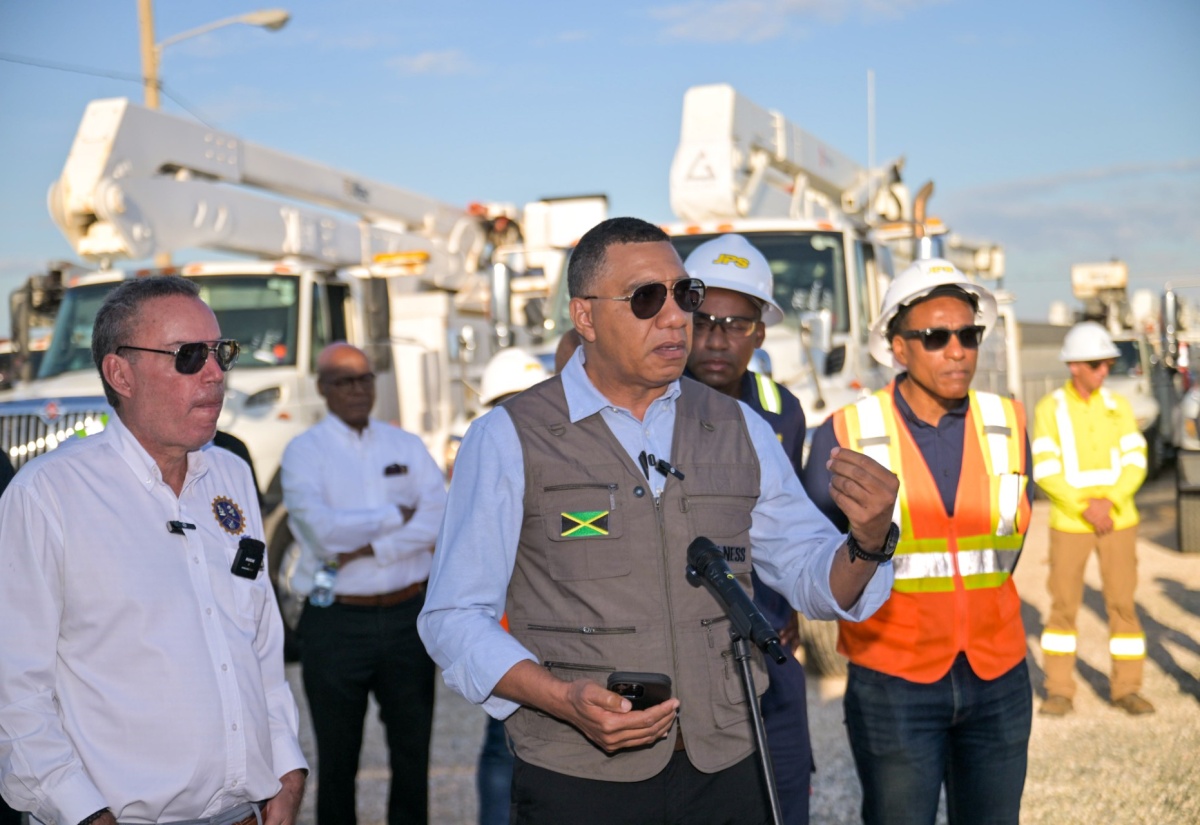 Prime Minister, Dr. the Most Hon. Andrew Holness (centre), addresses the commissioning of over 200 vehicles and equipment by the Jamaica Public Service (JPS) Company at the entity
