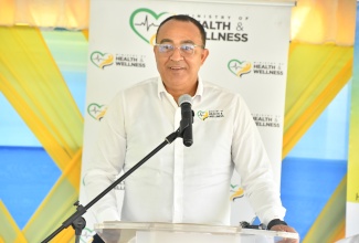 Minister of Health and Wellness, Dr. the Hon. Christopher Tufton, addresses the official handover ceremony for the newly rehabilitated Runaway Bay Community Health Centre in St. Ann on Friday (Jan. 16).