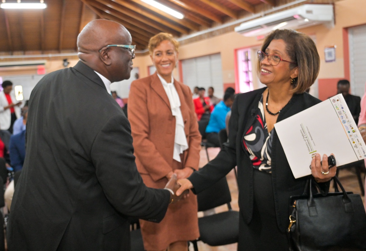 Permanent Secretary in the Ministry of Industry, Investment and Commerce, Sancia Bennett Templer (right), greets Executive Director of the Bureau of Standards Jamaica (BSJ), Dr. Velton Gooden, while Chair of the BSJ Standards Council, Jacqueline Millington, looks on. The exchange took place following the launch ceremony for the BSJ’s Information and Communications Technology (ICT) Accessibility Standards, held at the Bureau’s Multipurpose Facility in Kingston on Wednesday (February 25).


