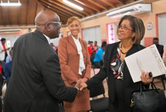 Permanent Secretary in the Ministry of Industry, Investment and Commerce, Sancia Bennett Templer (right), greets Executive Director of the Bureau of Standards Jamaica (BSJ), Dr. Velton Gooden, while Chair of the BSJ Standards Council, Jacqueline Millington, looks on. The exchange took place following the launch ceremony for the BSJ’s Information and Communications Technology (ICT) Accessibility Standards, held at the Bureau’s Multipurpose Facility in Kingston on Wednesday (February 25).

