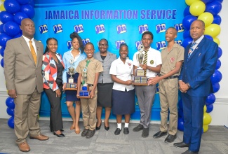 The Jamaica Information Service (JIS) executive management team, led by Acting Chief Executive Officer, Celia Lindsay (centre); Director of Corporate Services, Errol Gardner (left); Director, Research, Print and Production, Andrine Davidson (second left), and Director, Human Resource Management and Development, Dr. David Knight (right), share a photo opportunity with winners of the JIS 2025 Heritage Competition, during the awards ceremony on Tuesday (February 17) at Summit Kingston. The winners are (from second left) Shante Sinclair; Danash Brown; Alayna Elliott; Brian Levy and Bryce Wilson.