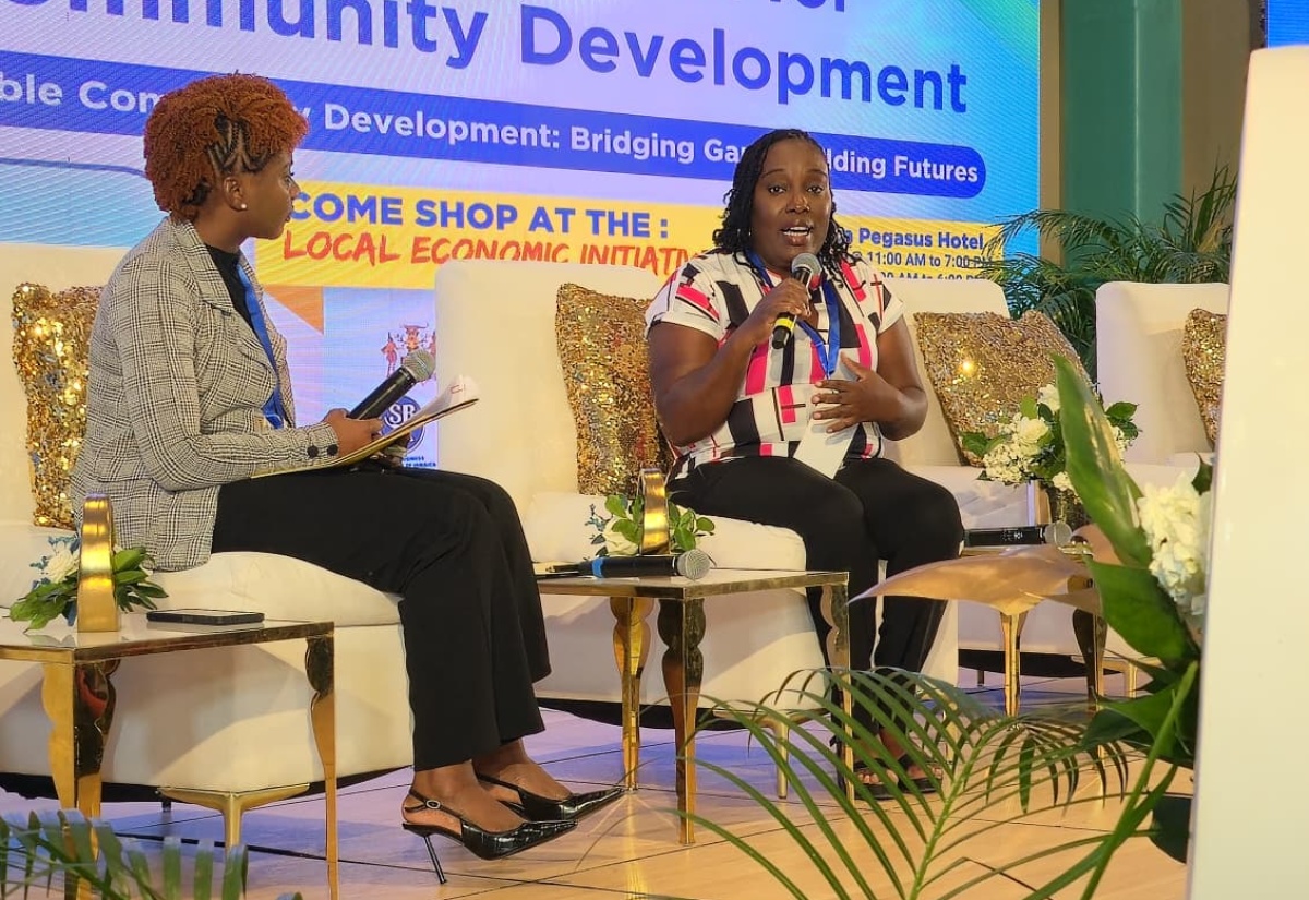 Taneka Stewart-Blake (right), former inmate at the South Camp Adult Correctional Centre, tells her story of transformation during the recent Planning Institute of Jamaica (PIOJ) Best Practice Symposium held at The Jamaica Pegasus hotel in New Kingston. Listening is interviewer, Rochelle Whyte. 

