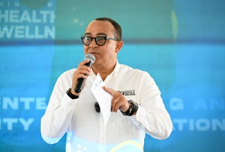 Minister of Health and Wellness, Dr. the Hon. Christopher Tufton, addresses residents of Belfield, St. Mary, during the official opening of the newly renovated Belfield Community Health Centre on February 19.