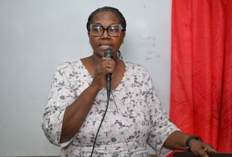 High School Diploma Equivalency Officer at the HEART/NSTA Trust, St. Thomas parish office, Cleopatra Francis, addresses the Bath Community Forum, held at the Bath Primary School on Wednesday (January 28).

