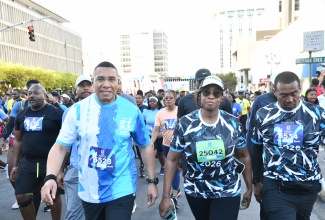 Prime Minister, Dr. the Most. Hon. Andrew Holness (left) along with wife of the Prime Minister, the Most Hon. Juliet Holness (second right), participate in the 28th staging of the Sagicor Sigma Run in Kington on Sunday (February 15).
