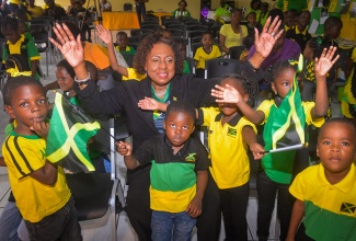 Minister of Culture, Gender, Entertainment and Sport, Hon. Olivia Grange (centre), celebrates Jamaica Day 2026 with students of the Foursquare Basic School in Kingston on Friday (February 27).